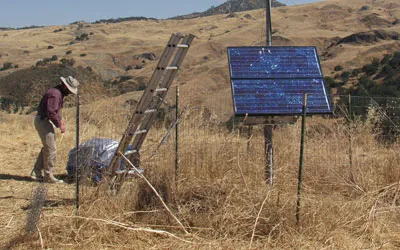 Person outside with various seismological devices